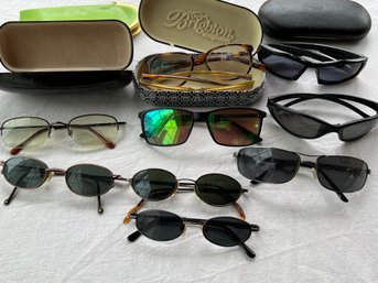 Group Of Sunglasses And Cases