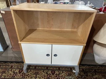 Footed Cabinet With Shelf