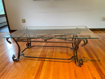 Glass Top And Metal Base Coffee Table.