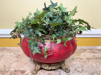 Faux Greenery In A Classical Footed Cache Pot