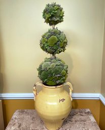 A Faux Topiary In An Amphora