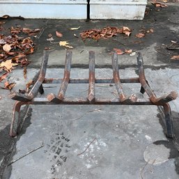 An Iron Fireplace Log Holder