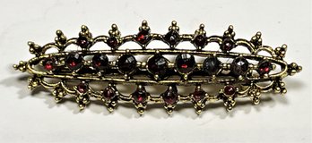 Vintage Gold Tone Brooch Having Dark Red Garnet-type Stones