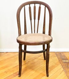 A Vintage Oak Spindle Back Side Chair With Restored Cane Seat