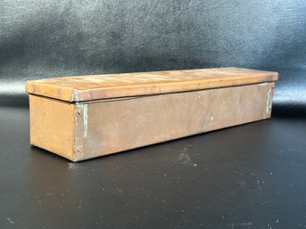 A Rustic Vintage Storage Box In Copper With A Hinged Lid