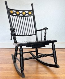 An Antique Painted Oak Rocking Chair With Gilt Details