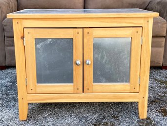 A Modern Farmhouse Chic Petit Cabinet With Stainless Top And Door Panels