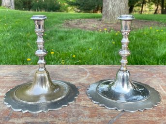 A Pair Of Nickel Plated Brass Candlesticks