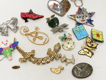 An Assortment Of Costume Pins And Accessories