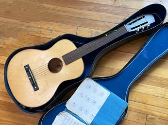 A Vintage Student Guitar In Case