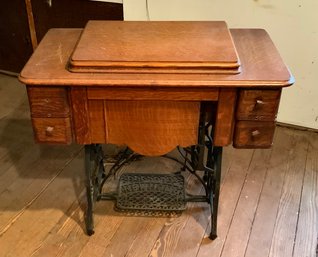 Antique New Home Sewing Machine In Wood Cabinet