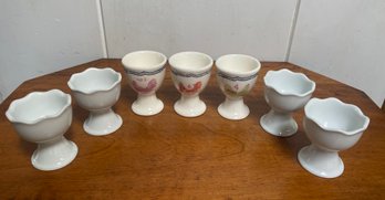 A Group Of Seven Ceramic Egg Cups