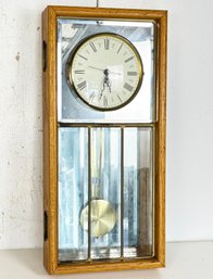 A Vintage Oak Wall Clock