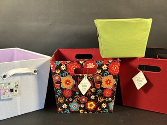 A Grouping Of Fabric Storage Bins