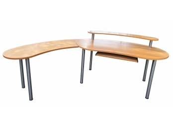 Kidney Shaped Blond Wood Veneer Desk With Tubular Metal Legs And Rounded End Piece