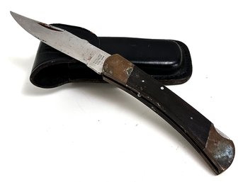 A Vintage Japanese Pocket Knife In A Leather Case