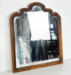 An Antique Carved Walnut Framed Mirror