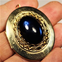 Vintage Gold Tone Oval Locket Having Blue Cabochon Glass Stone