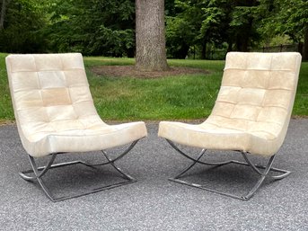 A Pair Of Modern Slipper Chairs In Cow Hide With Chrome Bases By Williams Sonoma Home