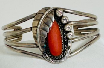 VINTAGE NATIVE AMERICAN STERLING SILVER AND CORAL FEATHER CUFF BRACELET