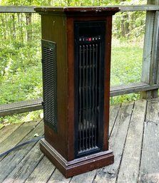 A Standing Heater In Oak Case