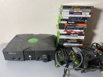 A XBOX WITH A LOT OF XBOX AND XBOX 360 GAMES