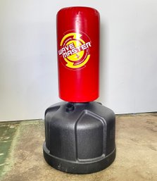 A Wave Master Punching Bag And Plastic Christmas Tree Stands