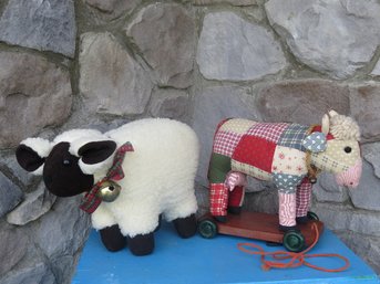 A Decorative Stuffed Sheep And Patchwork Steer Pull Toy