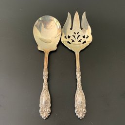 An Antique Matching Pair Of Sterling Silver Serving Pieces