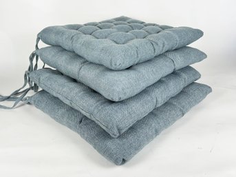 A Set Of 4 Stylish Tufted Linen Seat Cushions