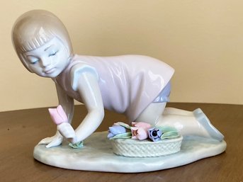 A Lladro Figurine, 5041, Girl Kneeling With Tulips - Retired