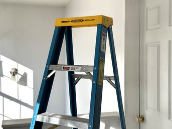 A Heavy-Duty Fiberglass Step Ladder By Werner, 6'