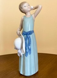 A Lladro Figurine, 5010, A Coiffure Girl With Blue Ribbon