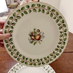 A Set Of 12 Royal Worcester Dinner Plates With Gold Trim