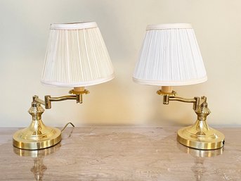 A Pair Of Articulating Arm Brass Sconces