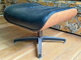 An Eames Leather Swivel Ottoman