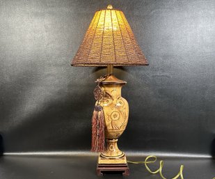 An Elegant Table Lamp With Ceramic Urn Body, Asian Tassel & Beaded Shade