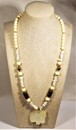 White Beaded Necklace Having Carved Buffalo Mother Of Pearl Pendant