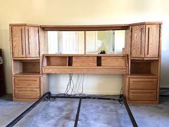 A Large Queen-Sized Bed Surround In Oak