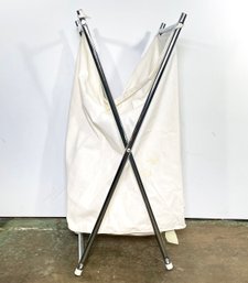 A Folding Chrome Clothes Hamper And Linen Liner