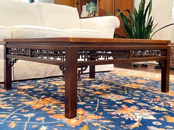 A Chinese Fruitwood Glass Top Coffee Table