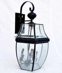 A Large Oil Rubbed Bronze Outdoor Lantern With Beveled Glass Panels