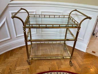 A Classic Three Tiers Brass And Glass Bar/Serving Cart On Wheels