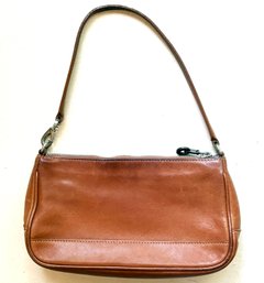 A Vintage Leather Purse By Coach