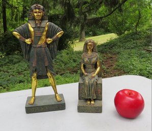 Two Egyptian Statues, One Of A Standing Tutankhamun, The Other Of His Wife Ankhesenamun Seated