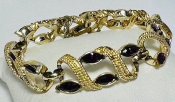 SIGNED CORO PURPLE RHINESTONE GOLD TONE BRACELET