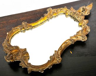 An Antique Gilt And Plaster Framed Mirror