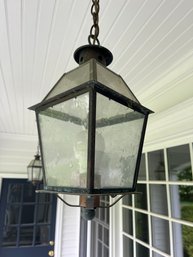 A Pair Of Exterior Copper Hanging Lanterns With Rustic Seed Glass