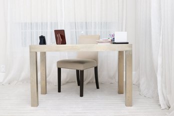 West Elm Parsons Desk Wrapped In Muted Age Gold Metal Sheeting And Cream Upholstered Chair With Nail Heads