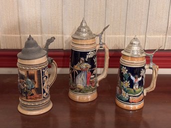 Three Collectible German Stoneware Lidded Beer Steins